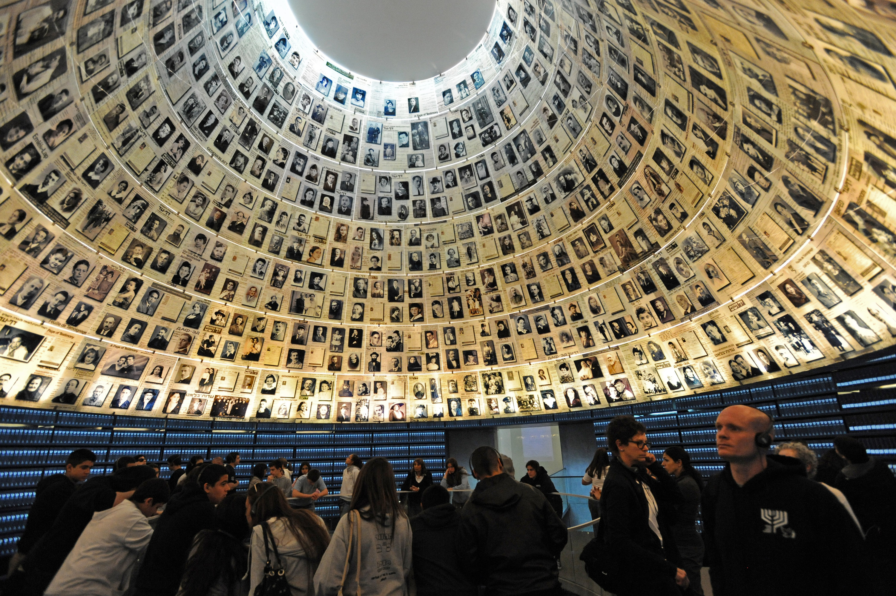 Tourists visit the Hall of Names in the Yad Vashem Holocaust Museum in Jerusalem on the eve of Israel's Holocaust Remembrance Day